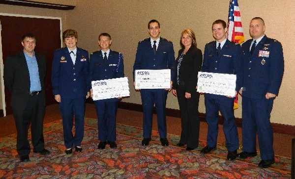 Gathering at the October scholarship presentations are (l-r) Aaron Miller, chapter vice president for scholarships; Gen. Janet Wolfenbarger, USAF; Cadet Tony J. Scott, Air Force ROTC; Cadet Bill B. Beard, Air Force ROTC; Andrea Kunk, chapter treasurer; Cadet William A. Sorenson, Air Force ROTC; and an ROTC commander.